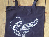 Brown tote bag with white print, first album logo photo 