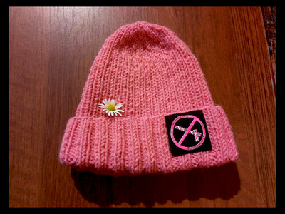 Hand-knitted beanie with "Fuk the borders" print. main photo