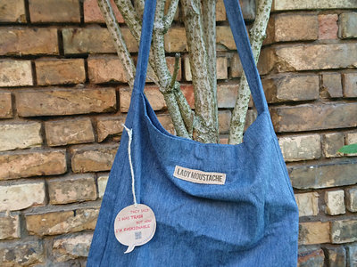 blue tote bag with 2nd hand leather patch main photo