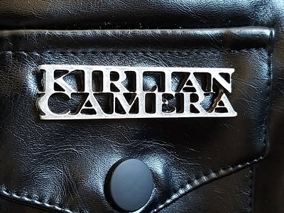 "Kirlian Camera" name shaped metal badge main photo