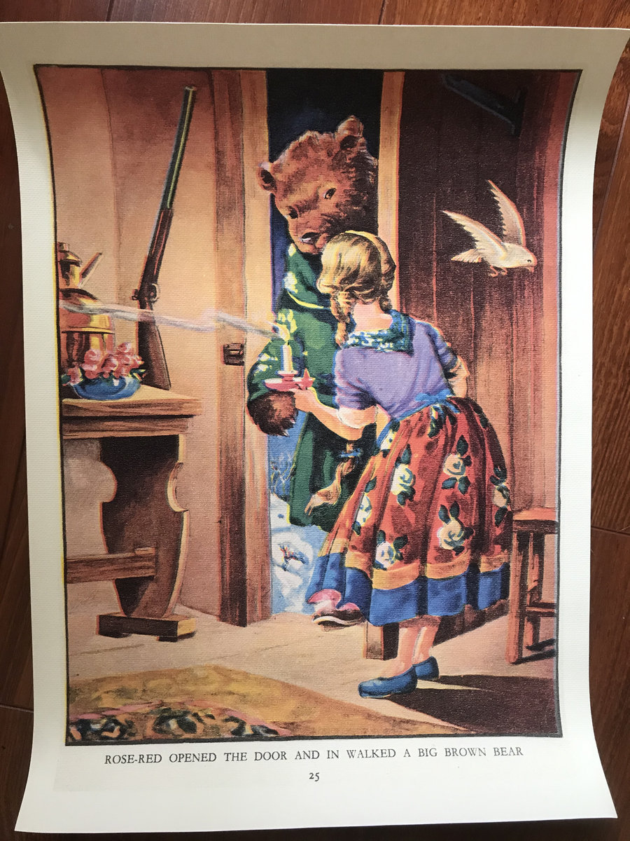 A picture form a story book with the text Rose-Red opened the door and in walked a big brown Bear underneath