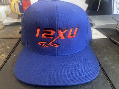 12XU baseball cap, blue with orange logo, Yupoong classics snapback main photo