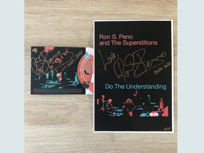 Do The Understanding signed A4 poster and signed cd bundle. main photo