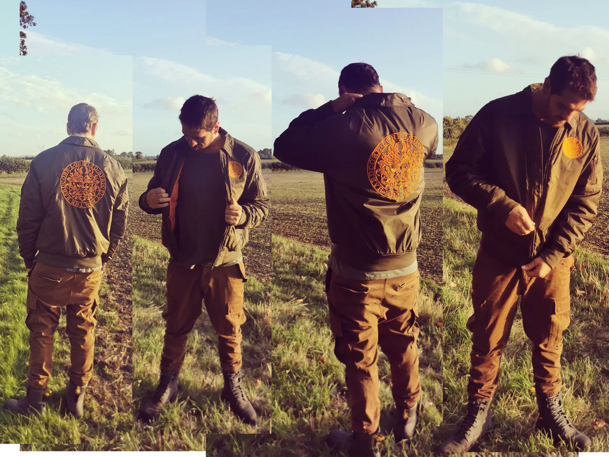 Olive green bomber shop jacket with orange inside