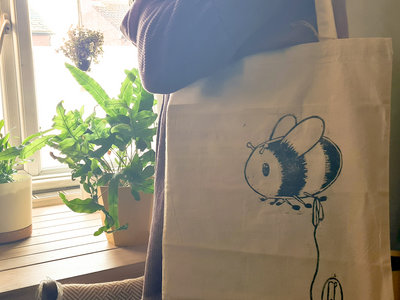 Bee on a String tote bags main photo