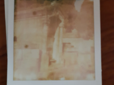 Broken polaroid/tomb main photo