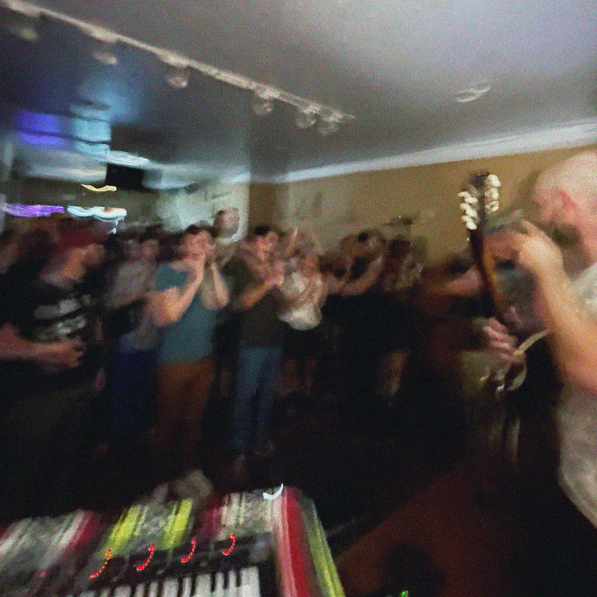 a very sweaty room full of people in Philadelphia enjoys the tunes of the great band Sinai Vessel