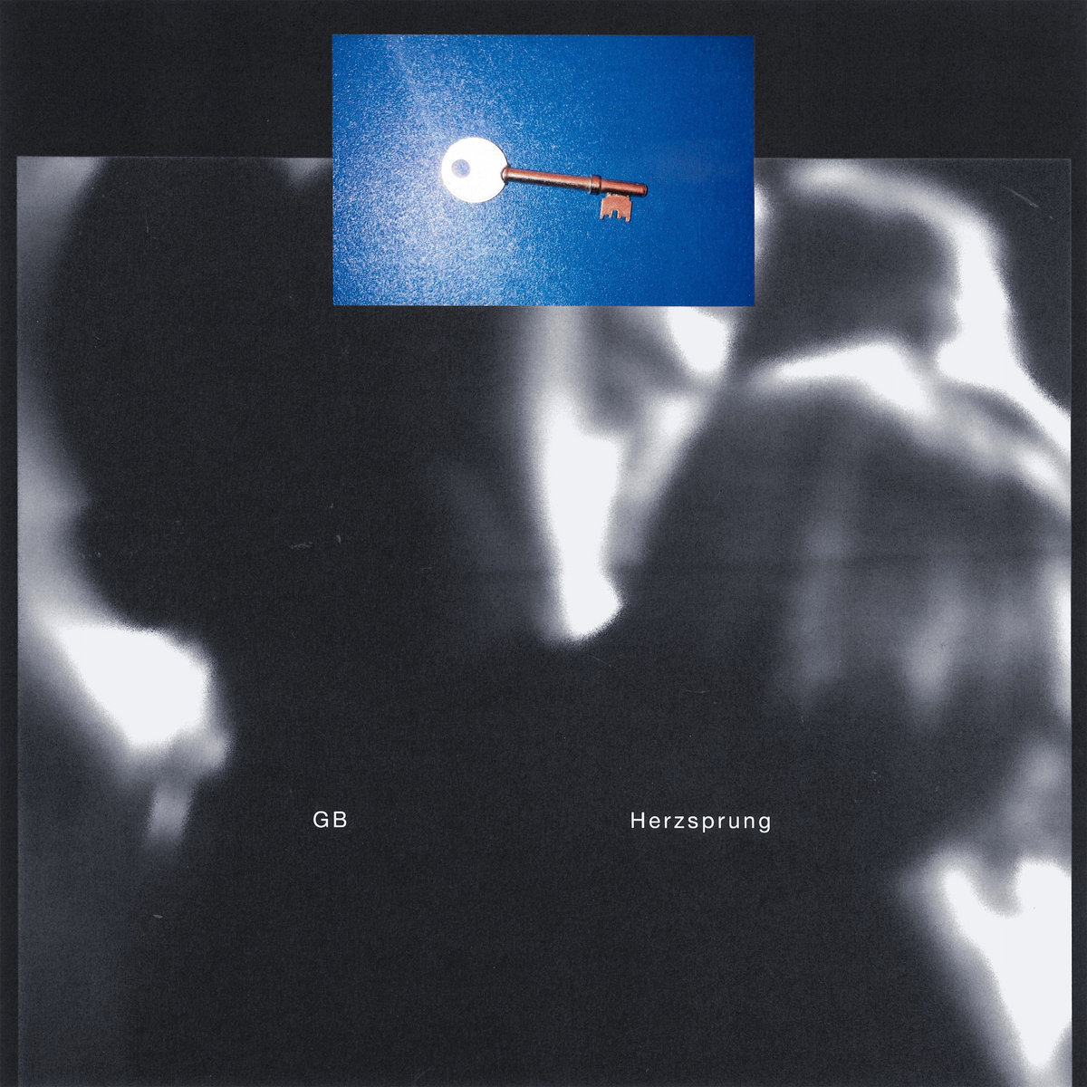 A blue photograph of a brass key beside a glowing white disc, pasted over a grainy black-and-white blur of indistinct figures. Small white text at the bottom reads GB and Herzsprung.