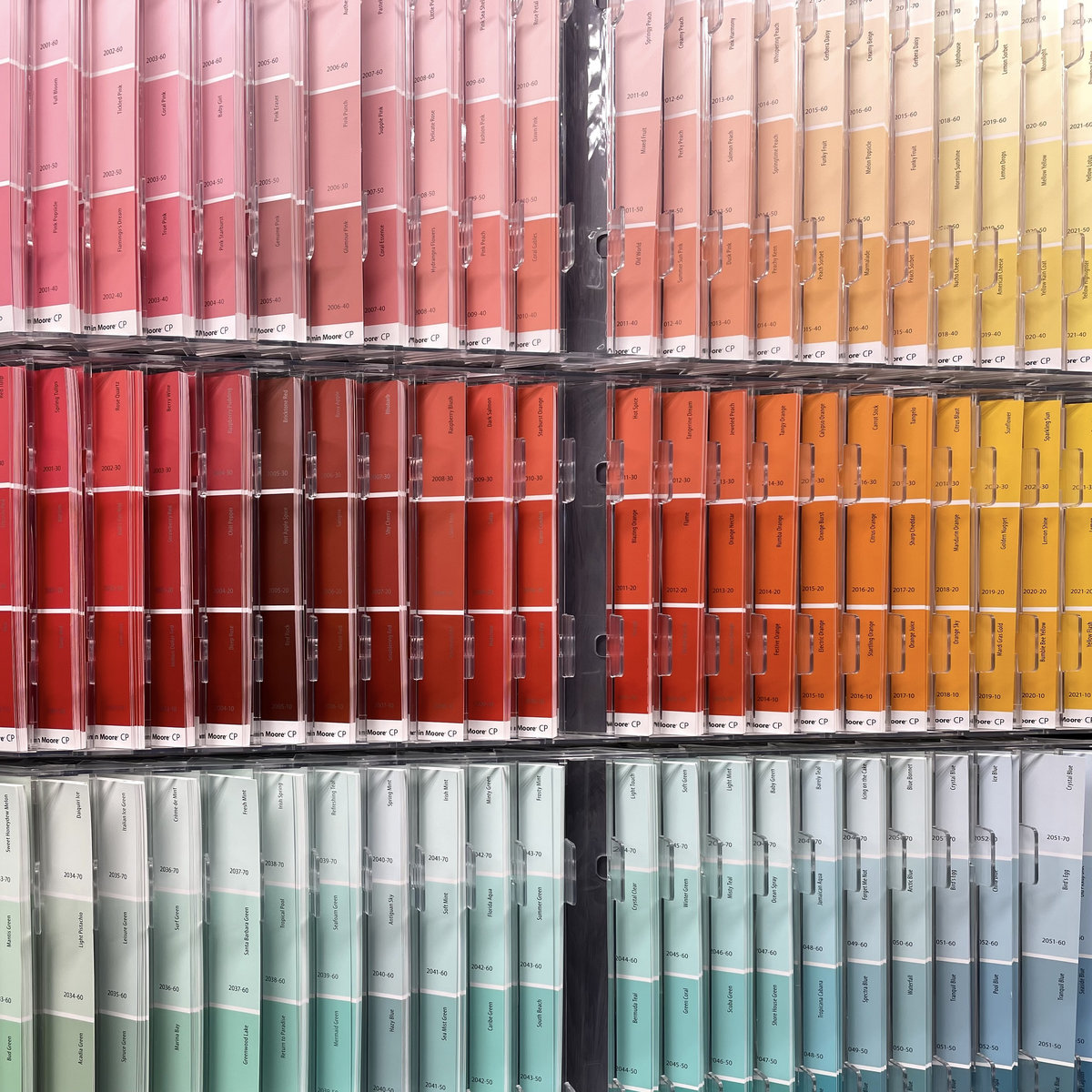 a rack of paint colors at a hardware store